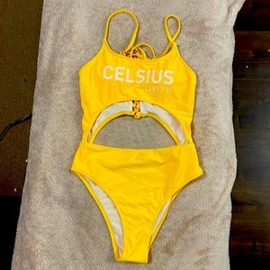 Yellow one piece. celsius live fit on the front. Adjustable shoulder straps